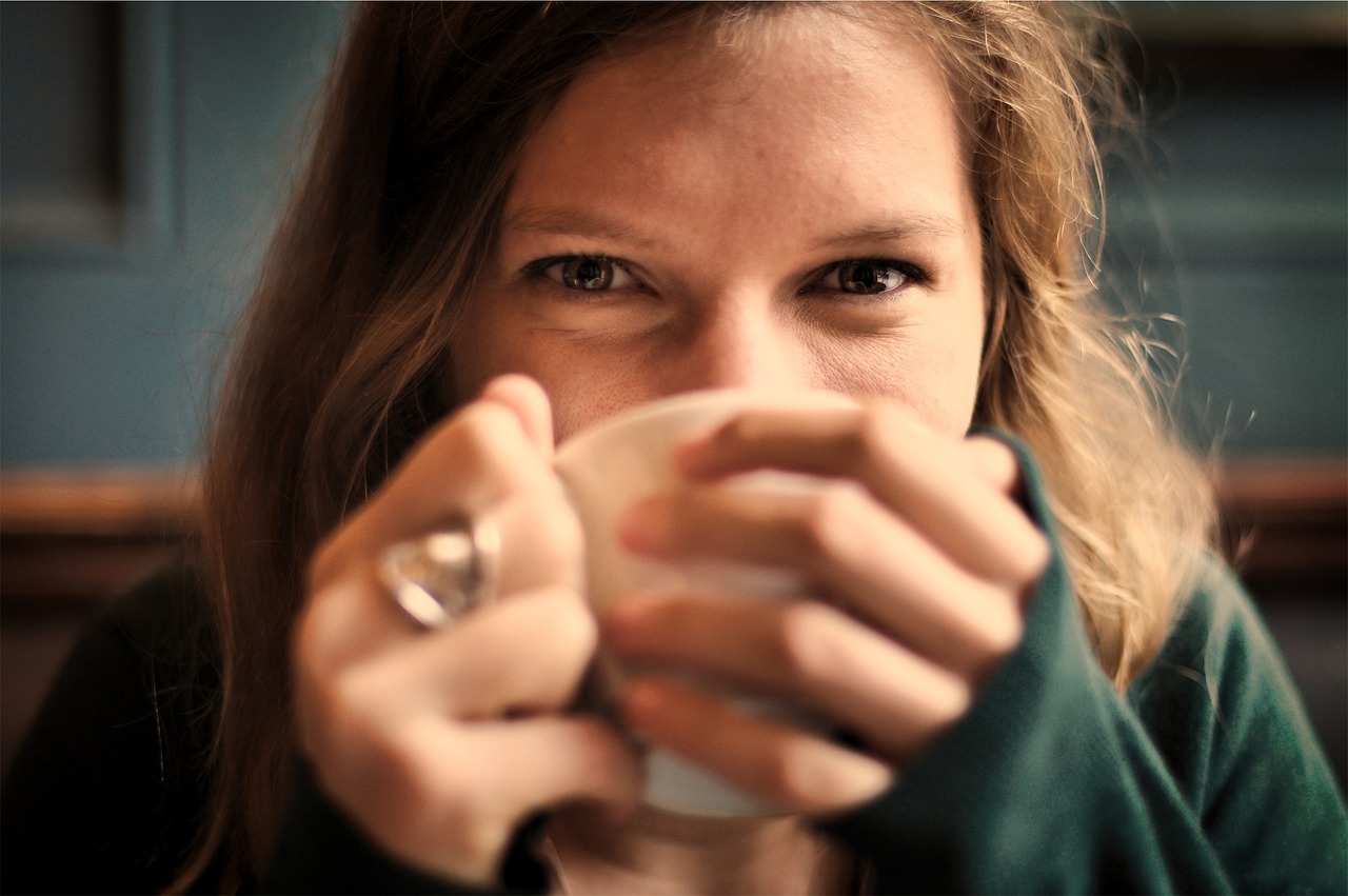 girl, woman, smile, smiling, happy, coffee cup, coffee, tea, cup, drinking, eyes, people, tea cup, cozy, comfortable, relaxed, sipping, brown coffee, brown happy, brown relax, brown tea, brown smile, brown eye, brown happiness, brown cup